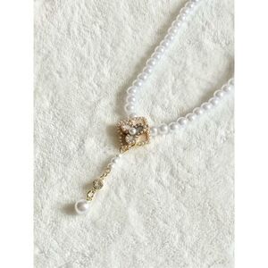 Faux pearl and cream rose statement necklace